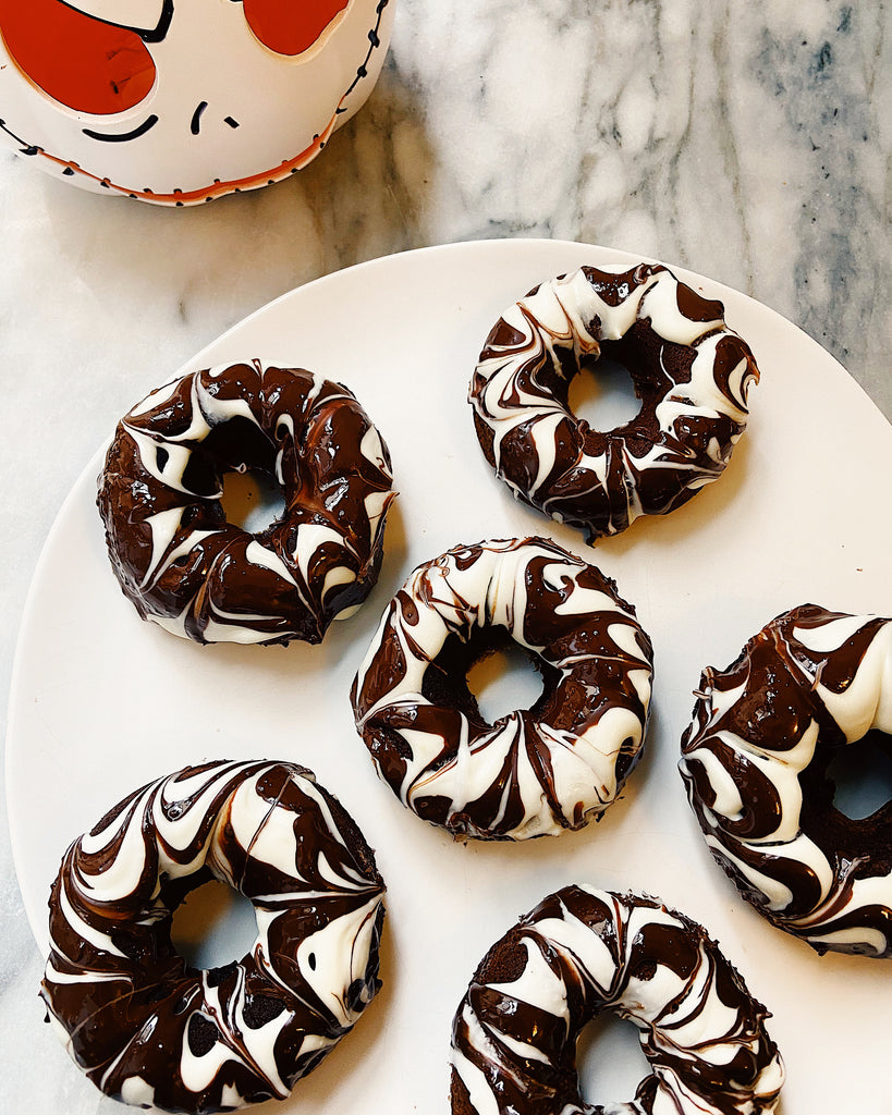 Get Tatiana's Recipe for Chocolate Baked Donuts with Spider Web Frosting